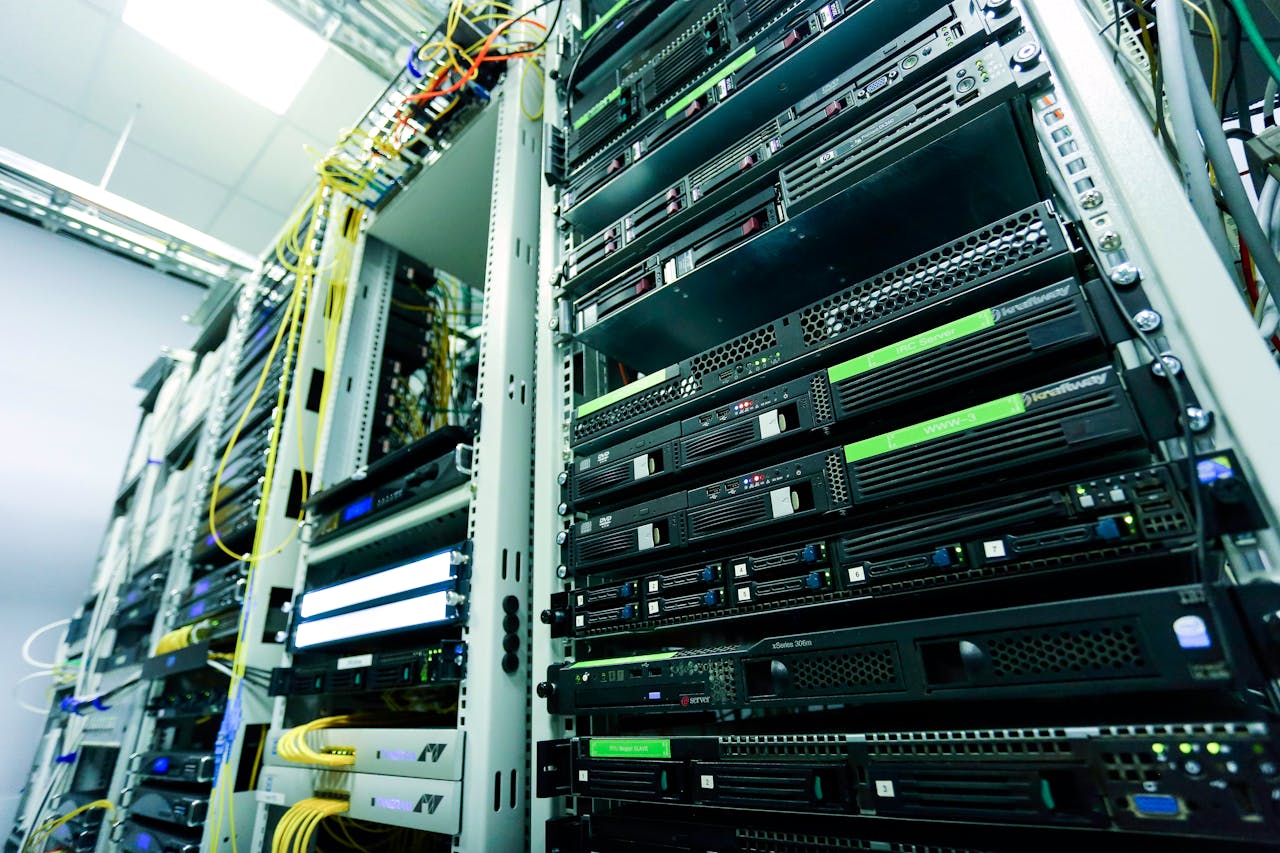 Services High-tech server rack in a secure data center with network cables and hardware components.